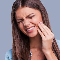 Как предотвратить боль после удаления зуба